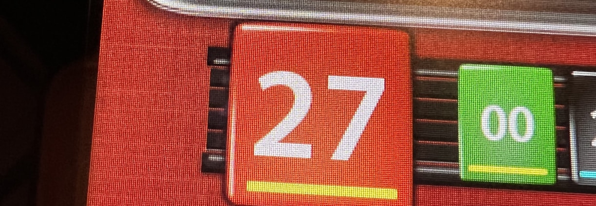 A digital display screen showing a casino betting interface, with text prompting to hurry bets and a highlighted number 27 in red. There are options for betting amounts and a 'share bets' button.